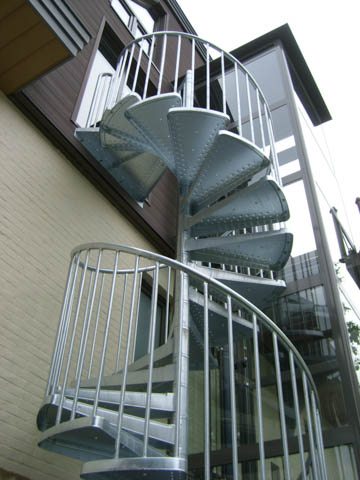 Spiral stairs, spiral staircases, curved staircases, curved stairs, custom made staircases, custom staircases from Italy, wood steps, glass steps, wooden stairs