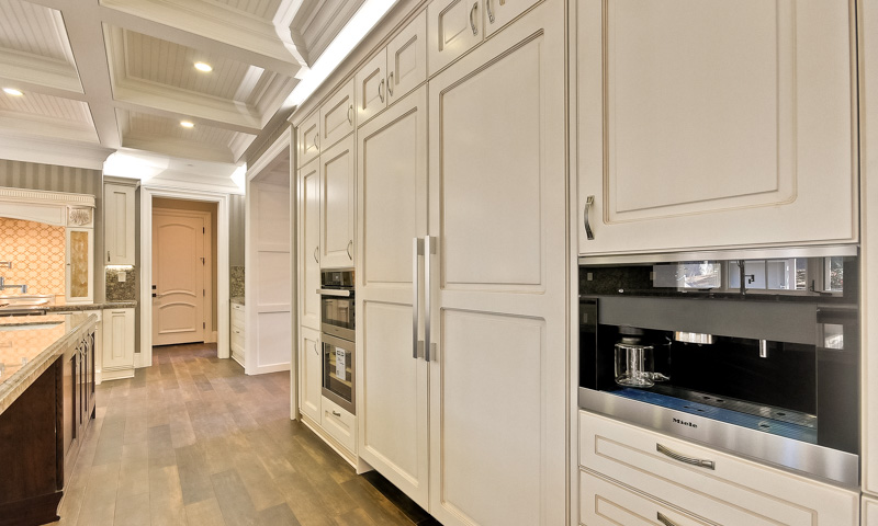 The built-in Miele coffee maker looks right at home in this traditional kitchen from the Aran Cucine Imperial collection.