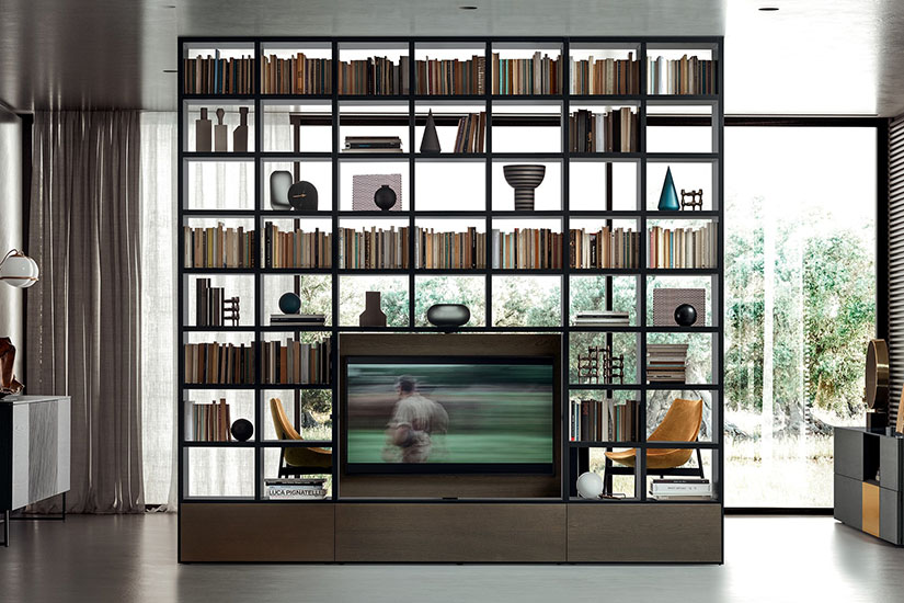 Open bookcase and entertainment center create great home office design.