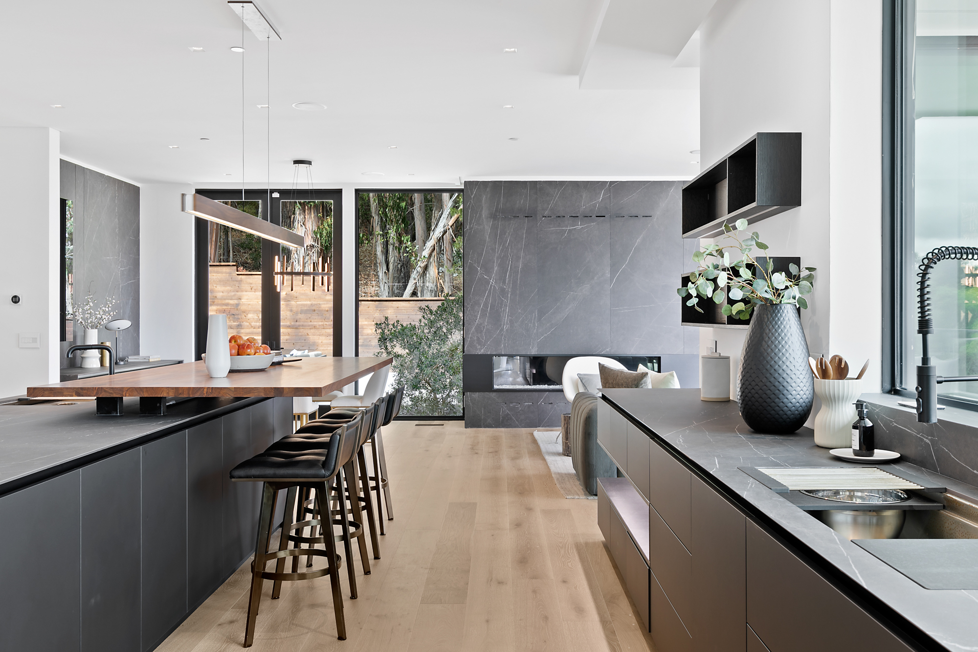 Modern Hillsborough kitchen remodel featuring sleek Italian cabinetry, a waterfall island, and integrated stainless steel appliances.