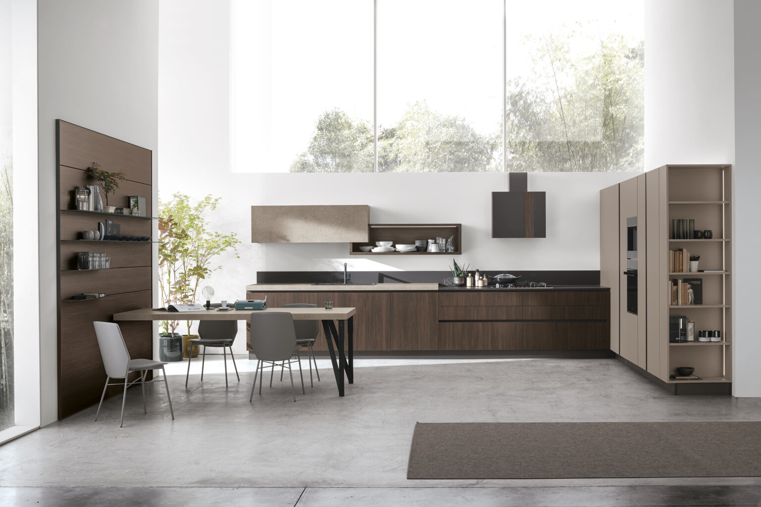 Modern Italian kitchen with dark wood-grain cabinets, beige tall units, open shelving and a dining table beneath large windows.